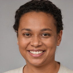 Joyful white adult female with short  brown hair and brown eyes