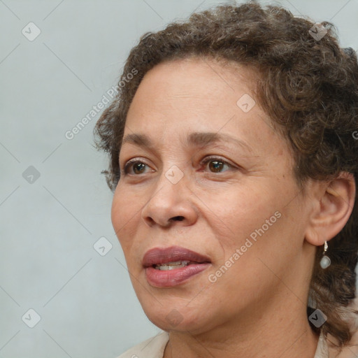 Joyful white adult female with short  brown hair and brown eyes