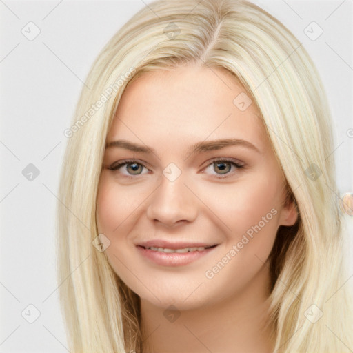 Joyful white young-adult female with long  brown hair and blue eyes