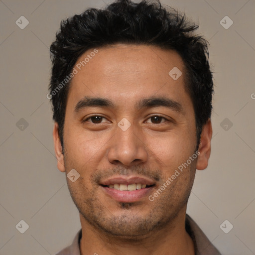 Joyful white young-adult male with short  black hair and brown eyes