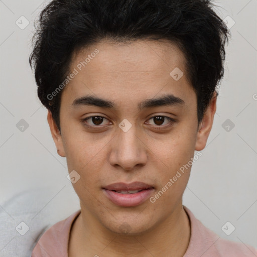 Joyful latino young-adult male with short  brown hair and brown eyes