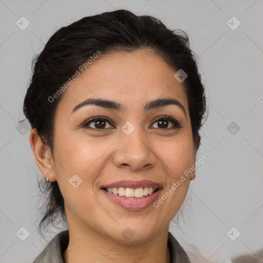 Joyful latino young-adult female with medium  brown hair and brown eyes