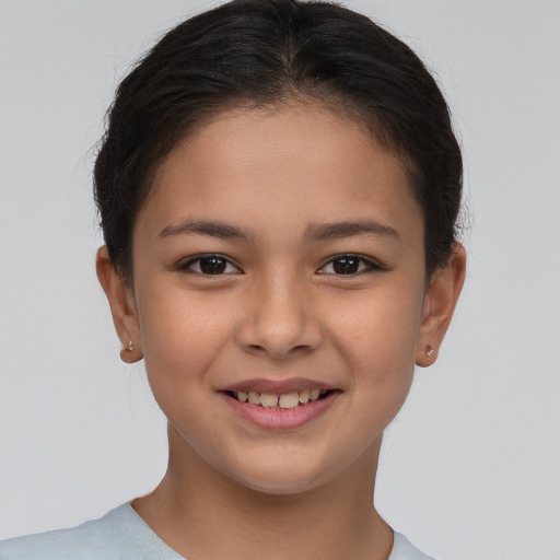 Joyful white child female with short  brown hair and brown eyes