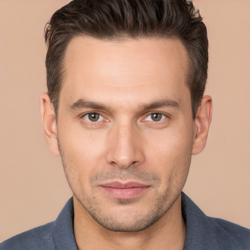 Joyful white young-adult male with short  brown hair and brown eyes