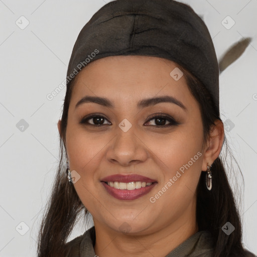 Joyful latino young-adult female with long  brown hair and brown eyes