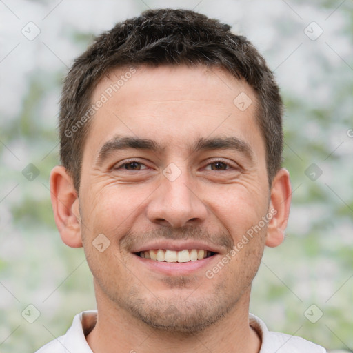 Joyful white young-adult male with short  brown hair and brown eyes