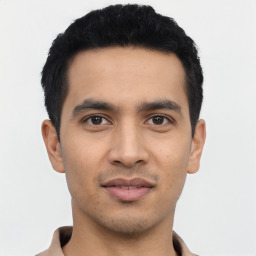 Joyful asian young-adult male with short  black hair and brown eyes