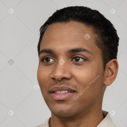 Joyful latino young-adult male with short  black hair and brown eyes