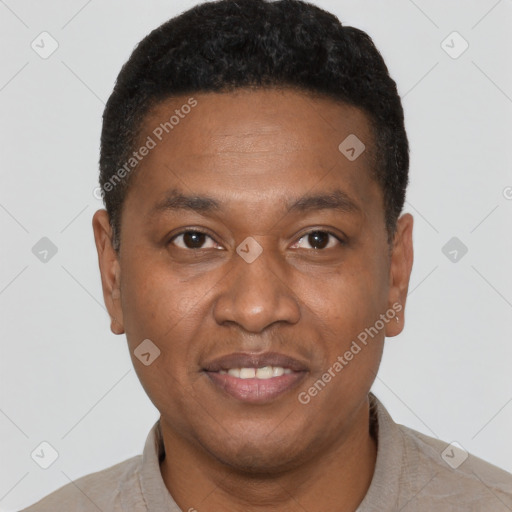 Joyful latino young-adult male with short  brown hair and brown eyes
