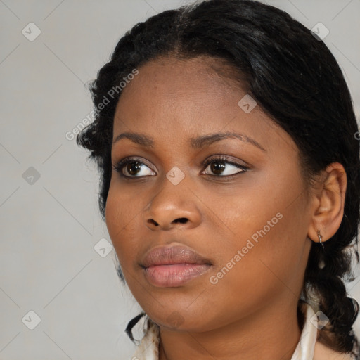 Neutral black young-adult female with medium  black hair and brown eyes