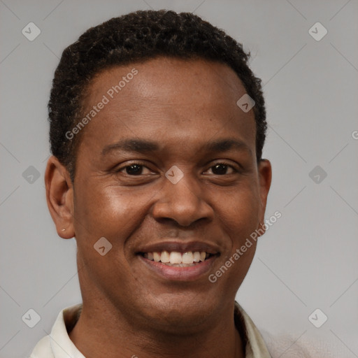 Joyful latino young-adult male with short  brown hair and brown eyes