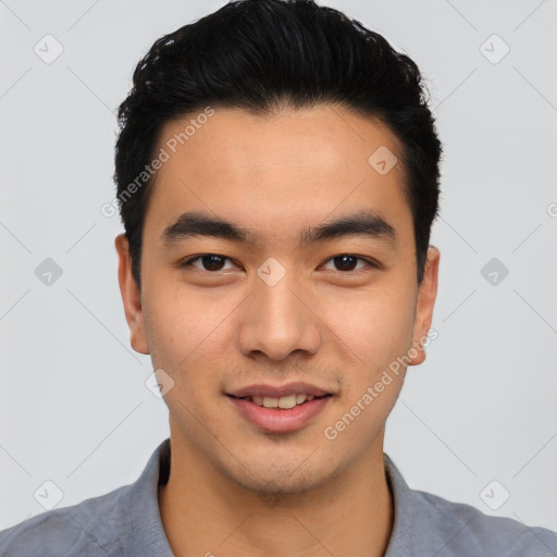 Joyful asian young-adult male with short  black hair and brown eyes