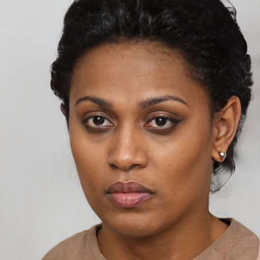 Neutral latino young-adult female with short  black hair and brown eyes