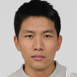 Neutral asian young-adult male with short  brown hair and brown eyes