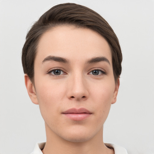 Neutral white young-adult female with short  brown hair and brown eyes