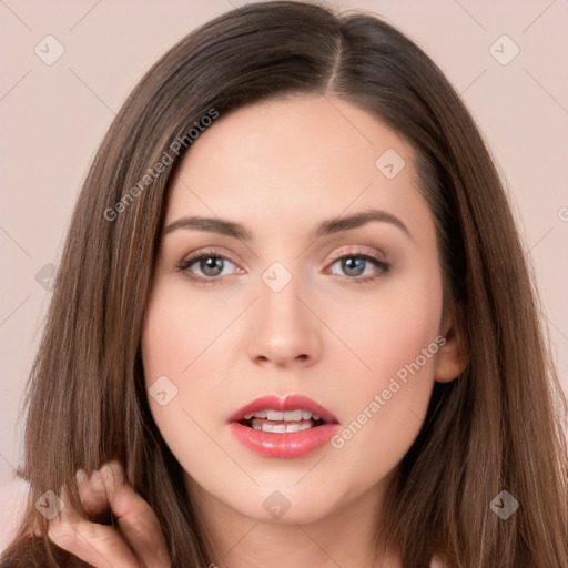 Neutral white young-adult female with long  brown hair and brown eyes