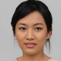 Joyful asian young-adult female with medium  black hair and brown eyes