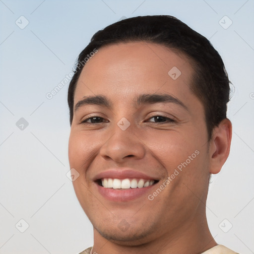 Joyful white young-adult male with short  black hair and brown eyes