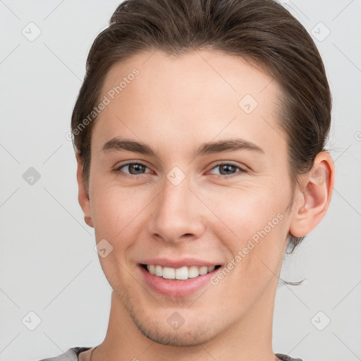 Joyful white young-adult female with short  brown hair and brown eyes