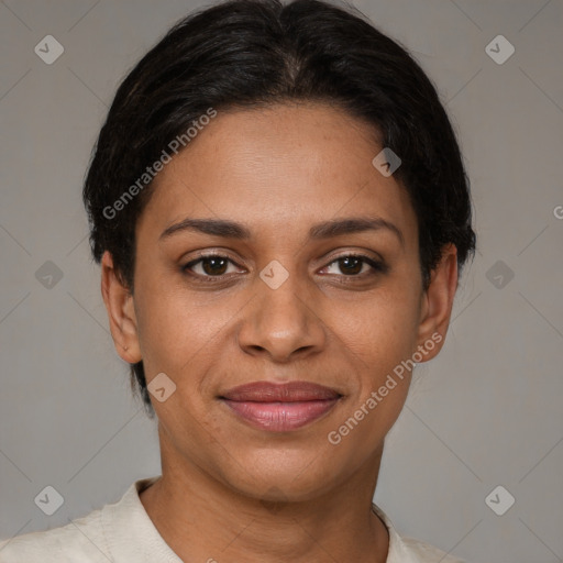 Joyful black young-adult female with short  brown hair and brown eyes