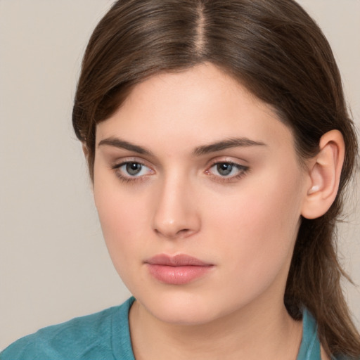 Neutral white young-adult female with medium  brown hair and brown eyes