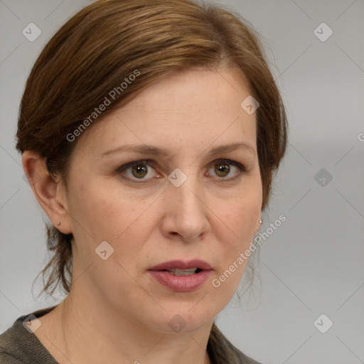 Joyful white adult female with medium  brown hair and blue eyes