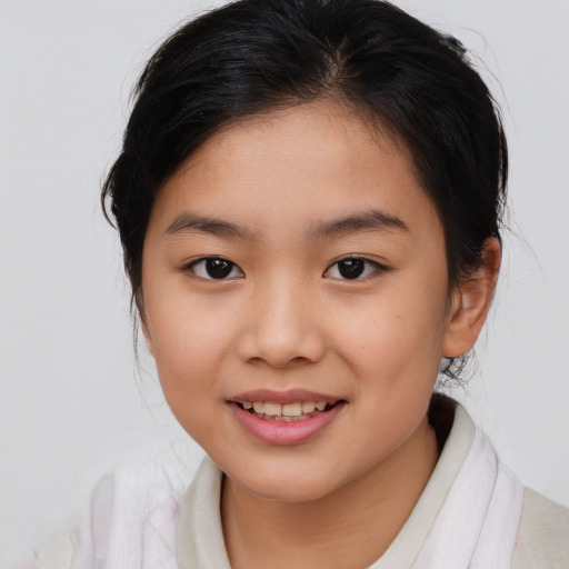 Joyful asian child female with medium  brown hair and brown eyes