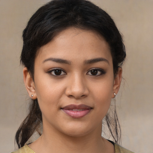 Joyful latino young-adult female with medium  brown hair and brown eyes