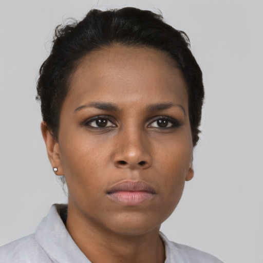 Neutral black young-adult female with short  brown hair and brown eyes