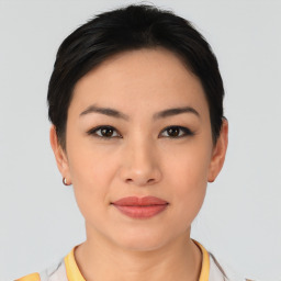 Joyful asian young-adult female with short  black hair and brown eyes