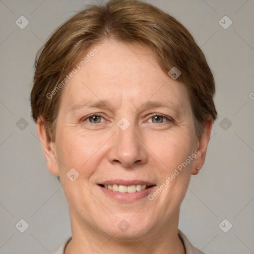 Joyful white adult female with short  brown hair and grey eyes