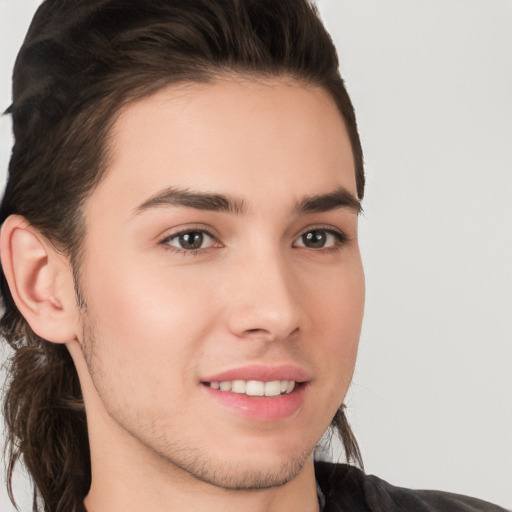 Joyful white young-adult male with medium  brown hair and brown eyes