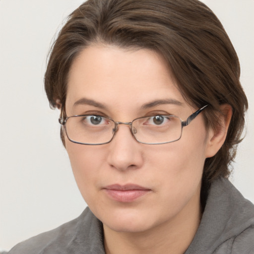 Neutral white young-adult female with medium  brown hair and grey eyes