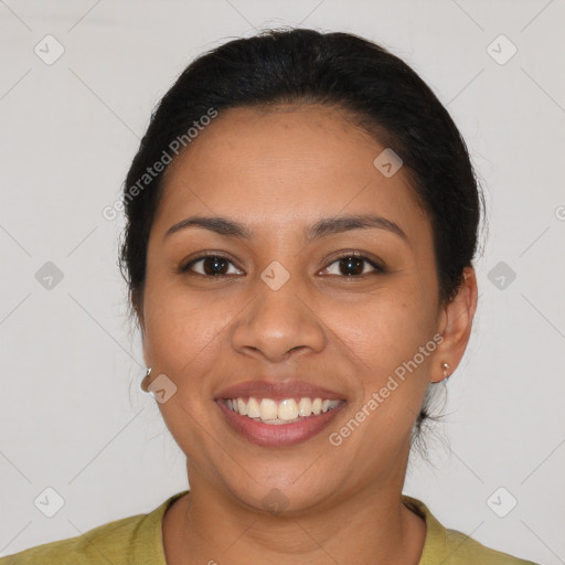 Joyful latino young-adult female with medium  brown hair and brown eyes