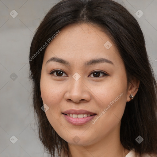 Joyful asian young-adult female with long  brown hair and brown eyes