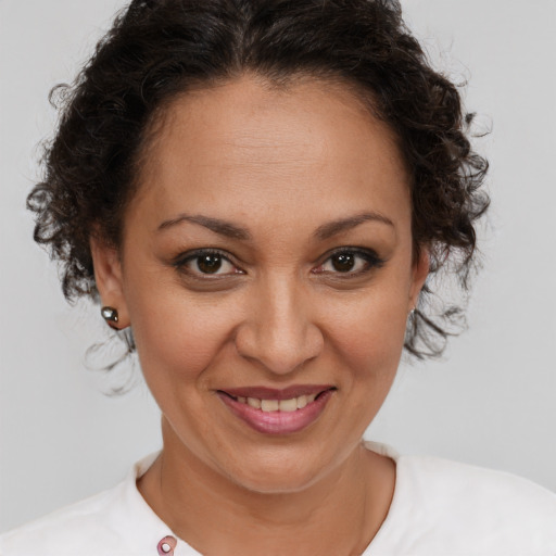Joyful white adult female with short  brown hair and brown eyes