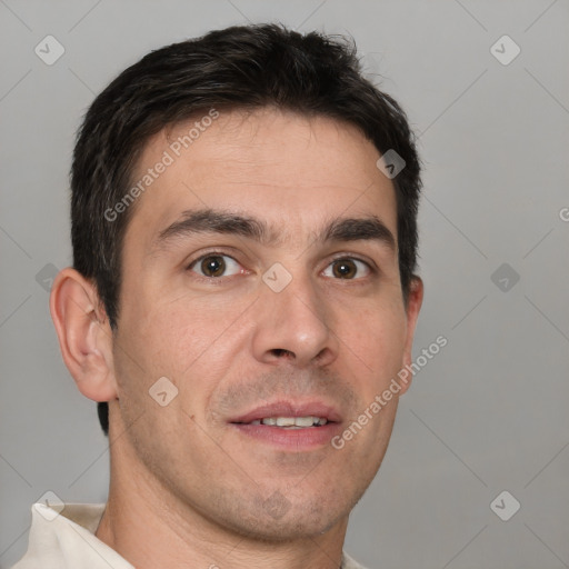 Joyful white young-adult male with short  brown hair and brown eyes