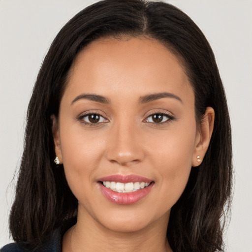 Joyful white young-adult female with long  brown hair and brown eyes