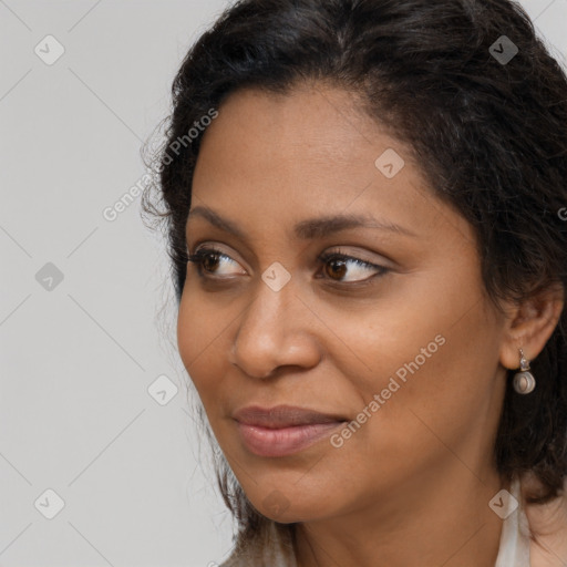 Joyful latino young-adult female with long  brown hair and brown eyes