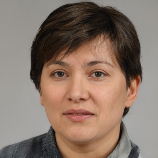Joyful white adult female with medium  brown hair and brown eyes