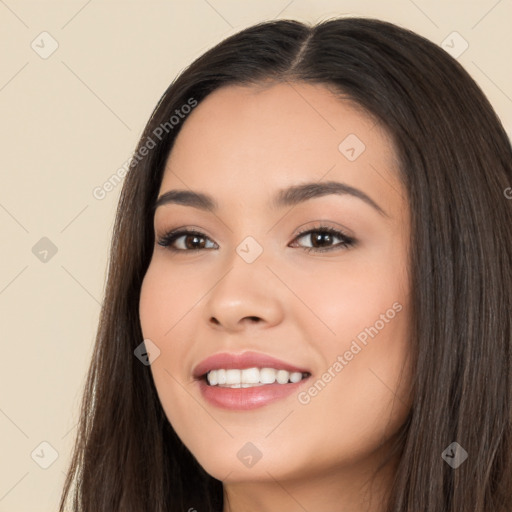 Joyful white young-adult female with long  black hair and brown eyes