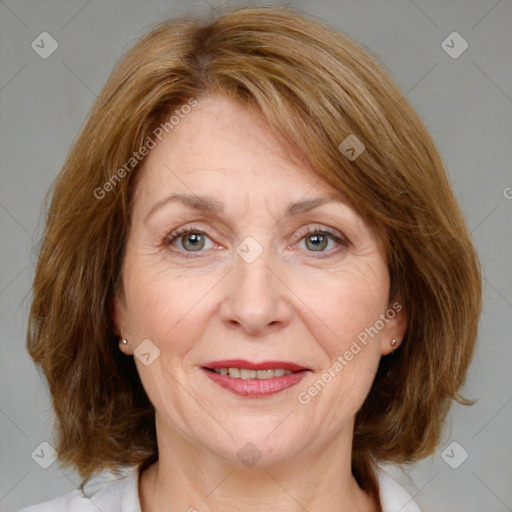 Joyful white adult female with medium  brown hair and blue eyes