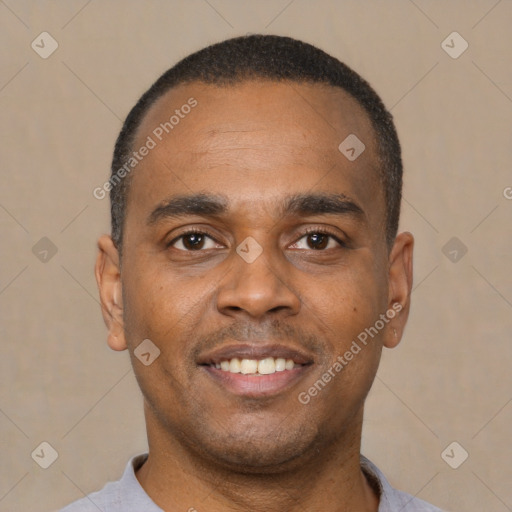 Joyful latino young-adult male with short  brown hair and brown eyes