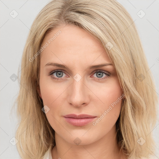 Joyful white young-adult female with long  brown hair and blue eyes