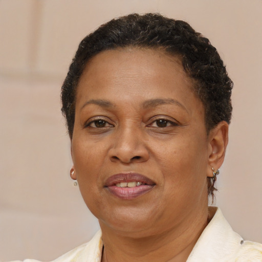 Joyful latino adult female with short  brown hair and brown eyes