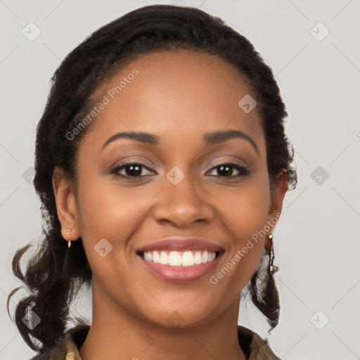 Joyful black young-adult female with long  brown hair and brown eyes