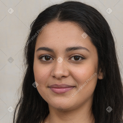 Joyful latino young-adult female with long  brown hair and brown eyes