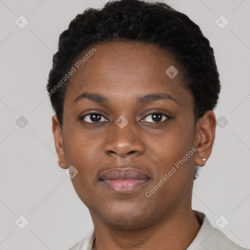 Joyful black young-adult female with short  brown hair and brown eyes