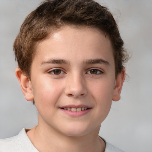 Joyful white child male with short  brown hair and brown eyes