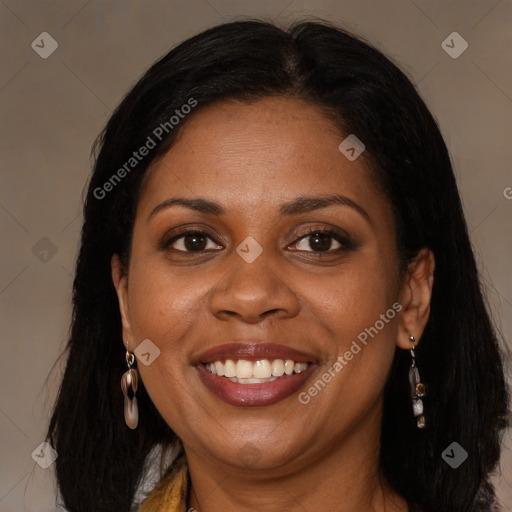 Joyful black young-adult female with long  brown hair and brown eyes